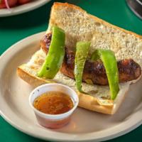 Italian Sausage · Specially prepared pork sausage char-grilled served with hot or sweet peppers.  Served on fr...