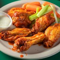 Buffalo Wings  · Tossed in our buffalo sauce served with  celery and choice of bleu cheese or ranch dressing.