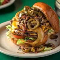 The Primo Burger* · A double burger char-grilled with choice of cheese on a bun with bacon, jalapeños, mushrooms...
