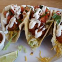 Three Ancho Shrimp Tacos · Grilled shrimp seasoned with ancho spice served with lettuce, cheese, pico and Lecrema sauce...