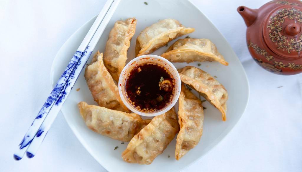 Mandu · Beef pot stickers fried and served with a side of housemade soy dipping sauce.