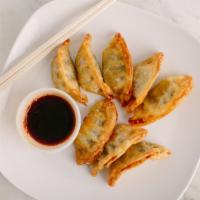 Veggie Mandu · Vegetarian pot stickers fried and served with a side of housemade soy-dipping sauce.