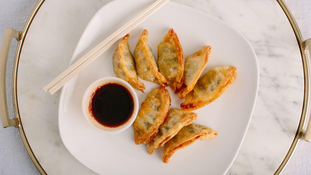 Veggie Mandu · Vegetarian pot stickers fried and served with a side of housemade soy-dipping sauce.