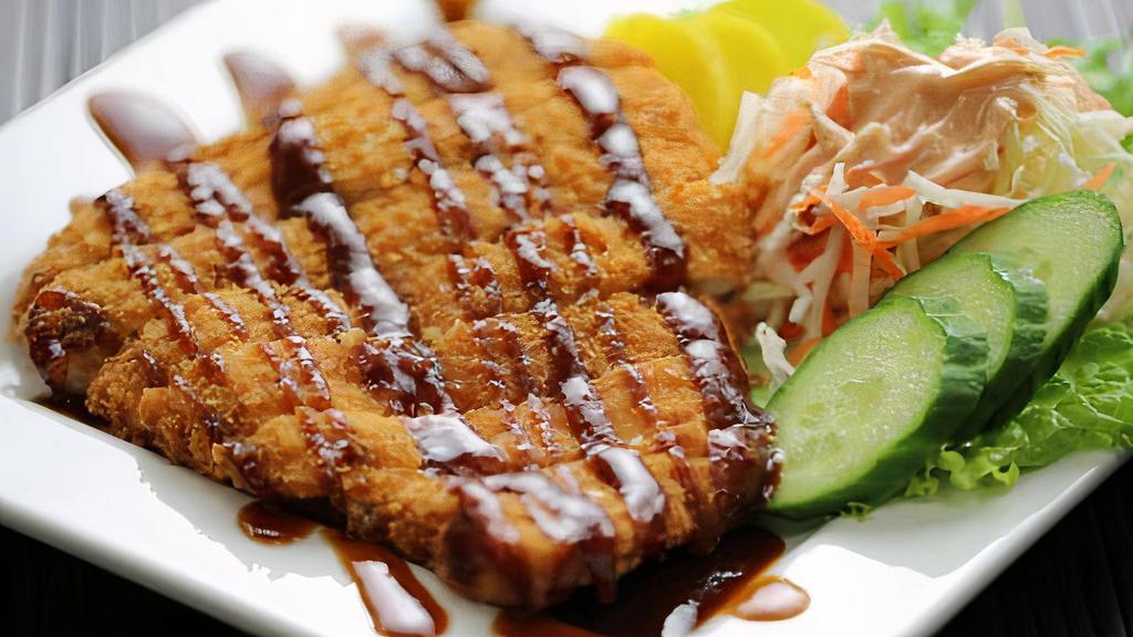 Chicken Katsu · Chicken breast breaded with crispy panko crust & deep-fried. Dressed with bold katsu sauce and served with radish condiments.