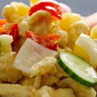Sweet & Sour Pork · Pork tenderloin fried in a light batter. Served with fresh vegetables and pineapples. Drizzl...