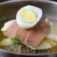 Mul Naeng Myun · Beef brisket, pickled radish, cucumber slices, jalapenos and hard-boiled egg layered on top ...