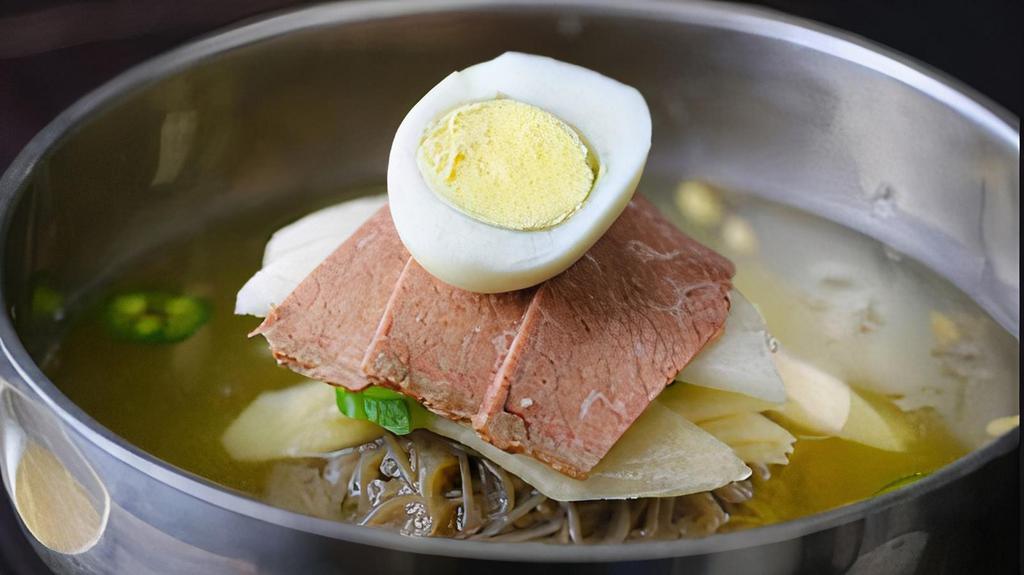 Mul Naeng Myun · Beef brisket, pickled radish, cucumber slices, jalapenos and hard-boiled egg layered on top of thin buckwheat noodles in icy beef broth.