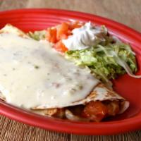Quesadilla De Fajitas · One quesadilla with your choice of marinated steak or chicken, green peppers, onions and tom...