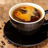 Americano · Triple shot of espresso combined with hot water.