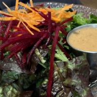 House Salad · Mixed greens with ginger dressing.