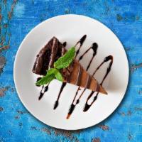 Chocolate Cake · A monster chocolate cake layered with chocolate mousse and covered with an outer chocolate c...