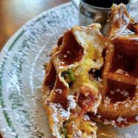 Set Piece · Savory stuffed waffle, egg, sausage, bacon, Cheddar and mozzarella cheese, red, green and ja...