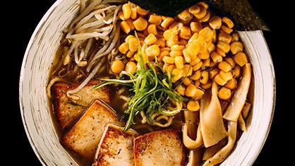 Vegan Ramen · Light vegetable broth, topped with grilled tofu. Moyashi, menma, negi, corn, and nori.