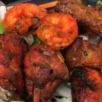 Tandoori Mixed Grill · Two kinds of chicken, two kinds of lamb and two pieces of shrimp.