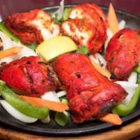 Tandoori Chicken · Half chicken marinated in yogurt and mild spices.