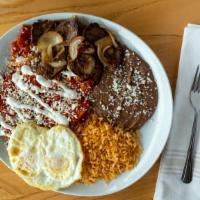 Chilaquiles Con Carne Asada · Your choice of green or red sauce, Steak, two eggs, served with rice and beans.