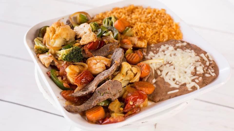 Erick Special · Steak, chicken, shrimp and vegetables, served with rice and beans.