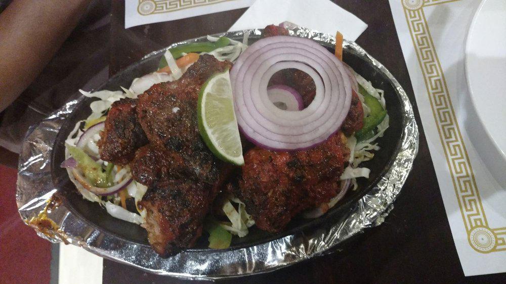 Kodi Tandoori (Chicken Tandoori - Half) · Chicken leg and thigh pieces are marinated overnight in yogurt with herb, spices, cooked on skewers in tandoor (clay oven).