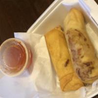 Chicken Spring Roll · Deep-fried homemade egg rolls filled with shredded vegetables and chicken. comes with 2 egg ...