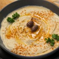 Hummus Appetizer · A mixture of mashed chickpeas, tahini, garlic, olive oil, and lemon juice. (Vegetarian)