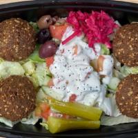 Falafel Appetizer · Ground chickpeas, garlic, and olive oil formed into balls, deep-fried, and Served with Jerus...