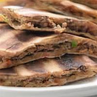 Arayes Beef · Ground beef and vegetables mixed and stuffed in pita bread and grilled.