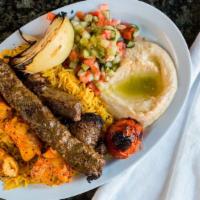 Mixed Grill Plate · One skewer of beef kabob, one skewer of chickenshish tawock, one skewer of beef kafta & side...