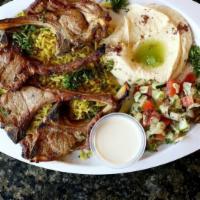 Lamb Chops Plate · Grilled tender and juicy lamb drops, very tasty. (the plate comes with rice, Arabic salad, h...
