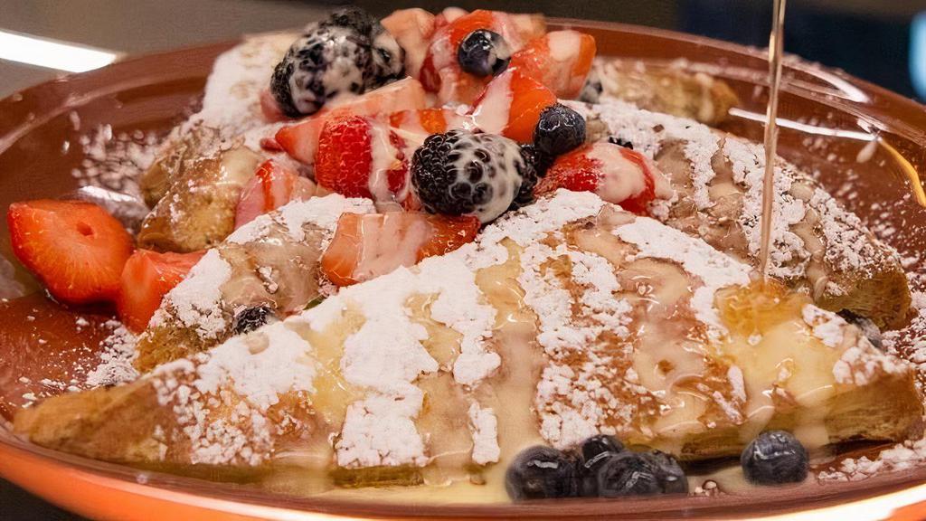 French Toast · Soaked Brioche, Cream Cheese Anglaise, Fresh Berries, Powdered Sugar & Warm Syrup