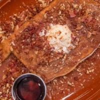 Famous Pancake · One Famous Cake made with Sweet Cream Batter, Bacon, Local Pecans, Bourbon Maple Glaze & Mas...