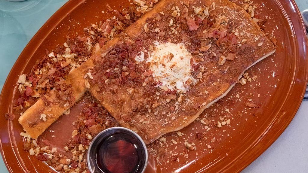 Famous Pancake · One Famous Cake made with Sweet Cream Batter, Bacon, Local Pecans, Bourbon Maple Glaze & Mascarpone Butter