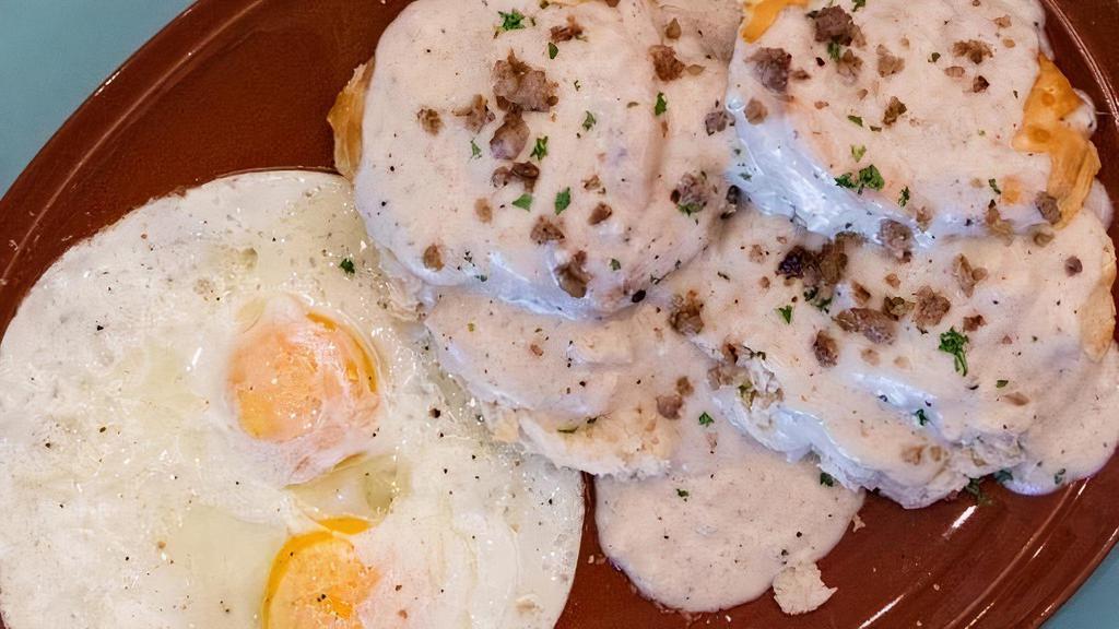 Biscuits & Gravy · Flaky Buttermilk Biscuits & Sausage Skillet Gravy Served alongside 2 Eggs your way (Black Pepper Cream Gravy Available)