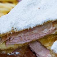Monte Cristo · Brioche, Turkey, Duroc Ham, Swiss & Cheddar Flash Fried & Topped with Powdered Sugar Served ...