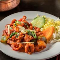 Chicken Chili · Gluten, spicy and soy. Boneless chicken stir-fried with bell pepper onion and chili.