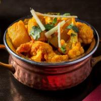 Aaloo & Gobhi · Cauliflower and potatoes sautéed to perfection in mild spices with tomatoes, onion, ginger, ...