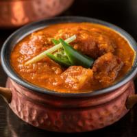 Chicken Vindaloo · Spicy. Boneless chicken and potato cooked with onion ferry hot gravy.