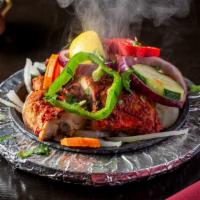 Tandoori Chicken (Full) · Whole chicken marinated in blend yogurt with ginger, garlic and herbs, barbecued in clay ove...