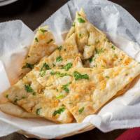 Garlic Naan · Dairy and gluten. Flat leavened soft bread bake in the tandoori oven with chopped garlic.