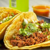 Chorizo (Mexican Sausage) Taco · Double corn tortilla, mexican sausage, fresh onion & cilantro.