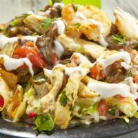 Pollo / Grilled Chicken Nachos · Grilled chicken, beans, shredded cheese, queso dip, lettuce, pico de gallo, jalapenos, sour ...