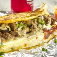 Fajita Quesadilla · Flour tortilla with shredded cheese, bell peppers, onion, and tomatoes inside, your choice o...