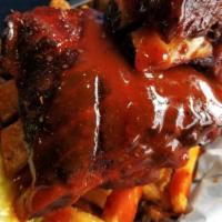 Firecracker Rib Bites · Low and slow smoked rib bites smothered with our new firecracker bbq sauce. Served over a ba...
