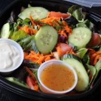 House Salad · Spring greens, tomato, carrot, cucumber and choice of dressing.