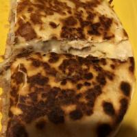 Quesadilla Rellena · One grilled flour tortilla stuffed with choice
of beef or chicken with beans & cheese,
serve...