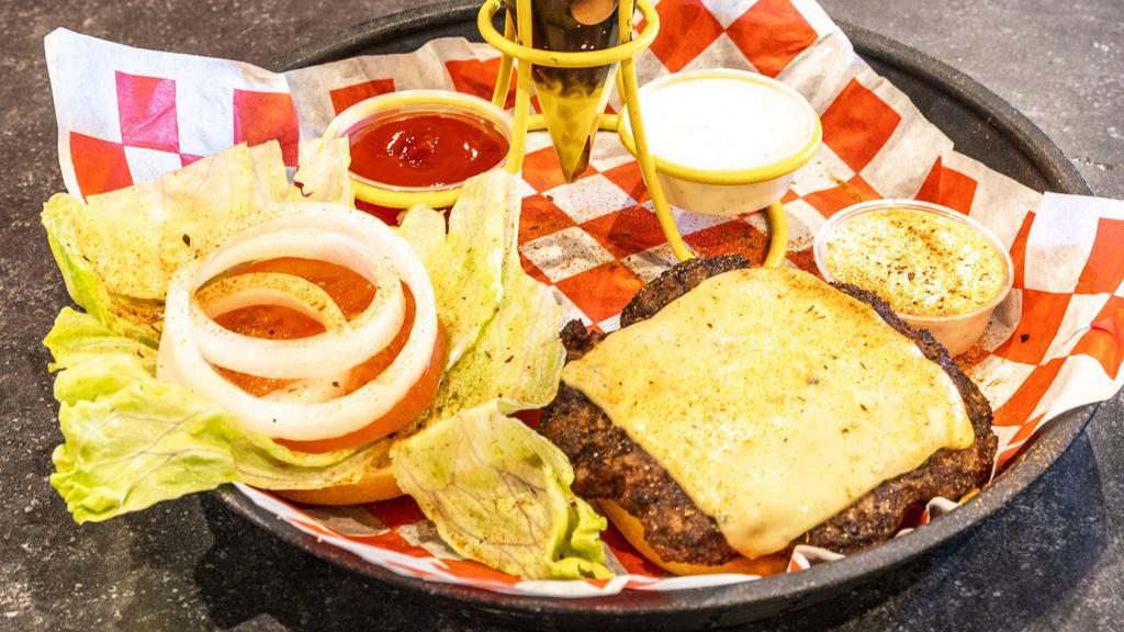 Cajun Ranch Burger · Our half-pound burger, topped with melted Pepper Jack cheese, lettuce, tomato, onion and our zesty Cajun ranch sauce. The best burger on the planet.