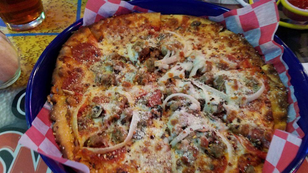 Spaceship Supreme Pizza · Our homemade crust, topped with pepperoni, Italian sausage, onions, mushrooms, banana pepper rings, roasted garlic, and our unique special-cheese blend. Awesome flavor.