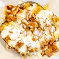 Cajun Ranch Chicken Potato · Sliced chicken, butter, cheddar cheese, bacon bits, diced tomatoes, zesty cajun ranch dressi...