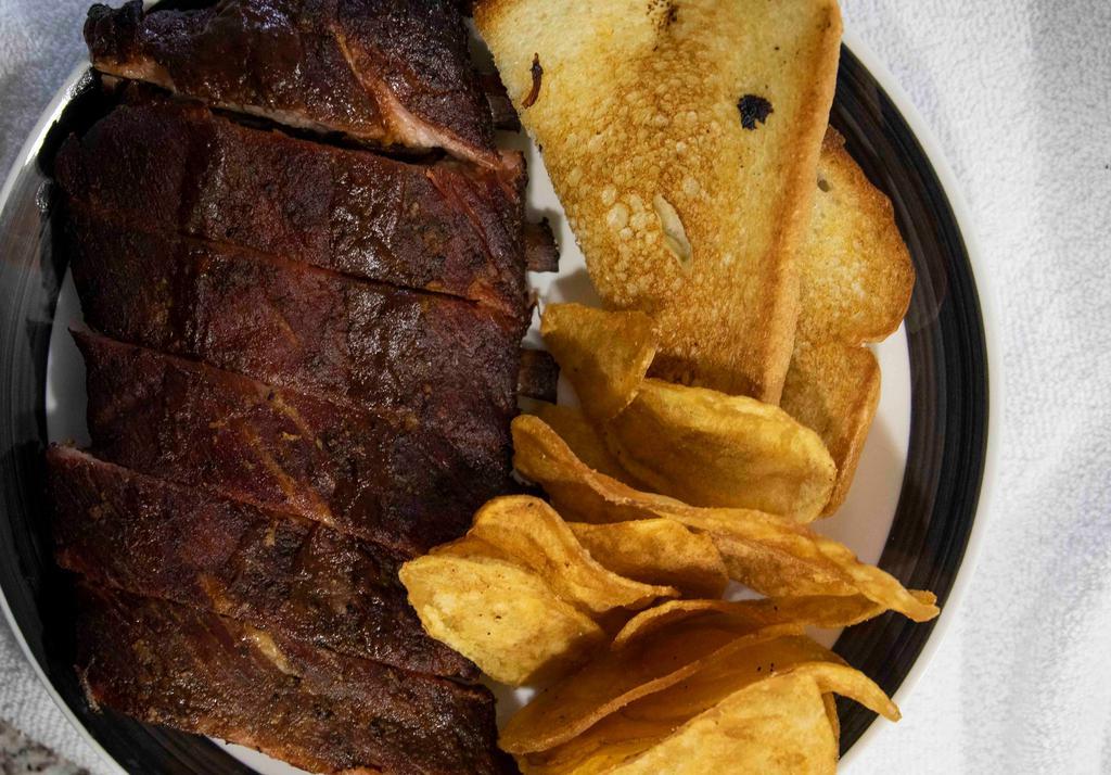 Half Rack Dinner · A Half Rack of Slow-Smoked Ribs topped with Original Barbecue Sauce, served with Two pieces of Texas Toast and your choice of 2 Sides.