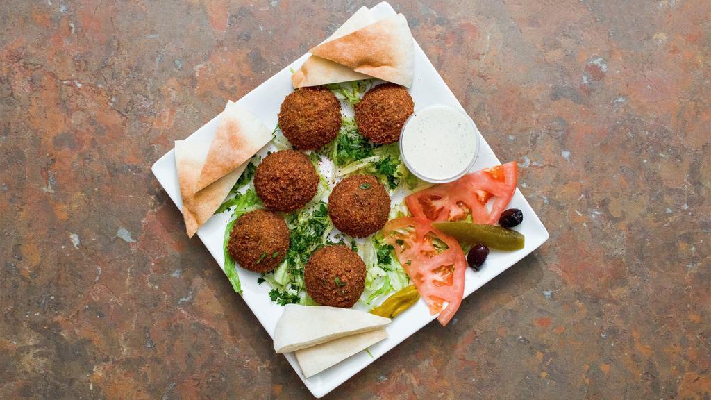 6 Pc. Falafel Patties · Seasoned chickpeas mixed with parsley, garlic and onions then deep fried. Served with tahini sauce and pita bread.