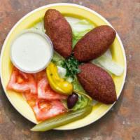 (3)Fried Kibbe · The delicate outer crust of bulgar wheat and aromatic herbs filled with ground beef, pine nu...